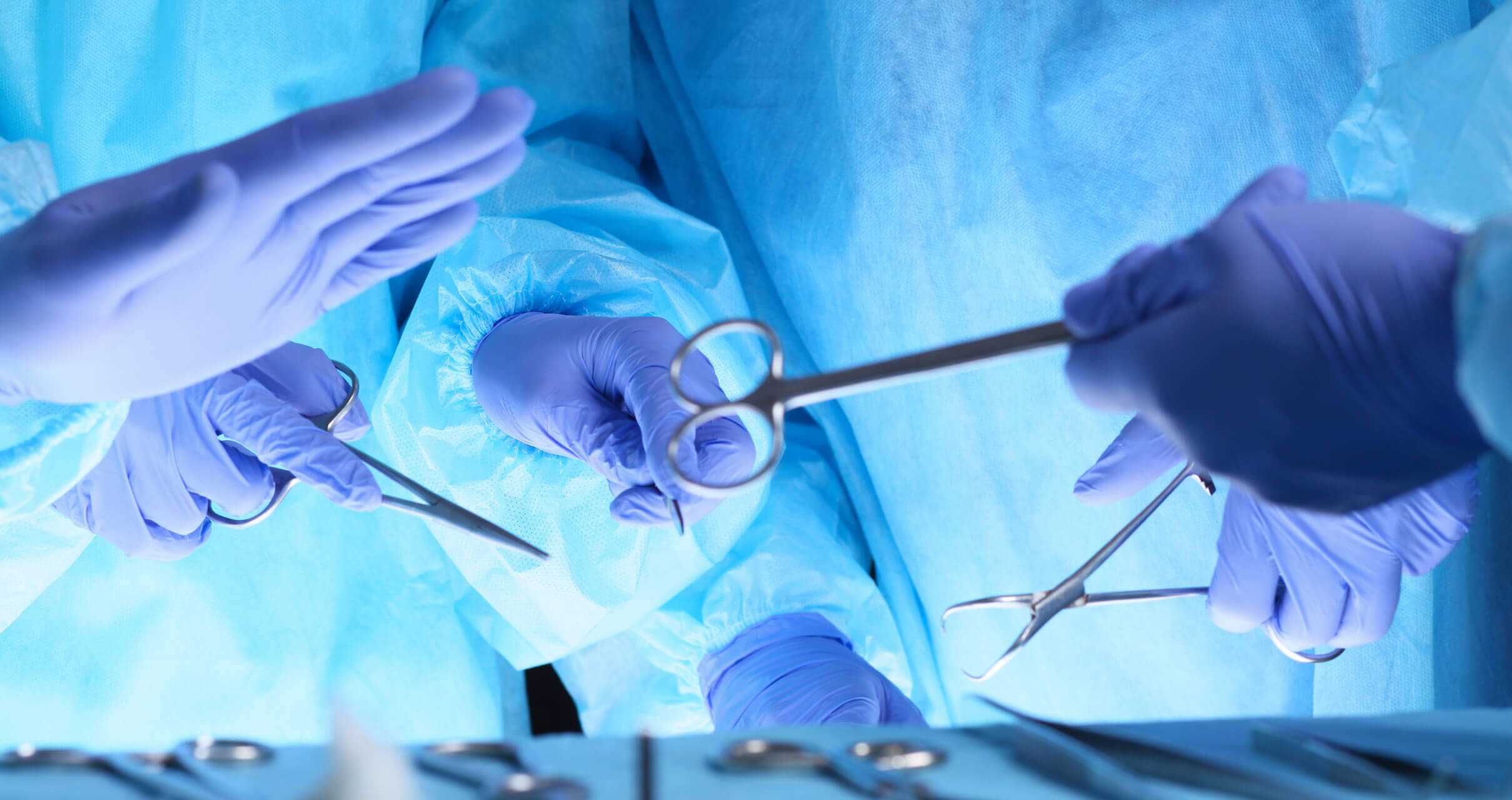 doctors handling surgical equipment